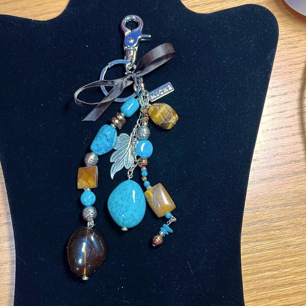 Miche bag turquoise, and brown charm keychain. Never used